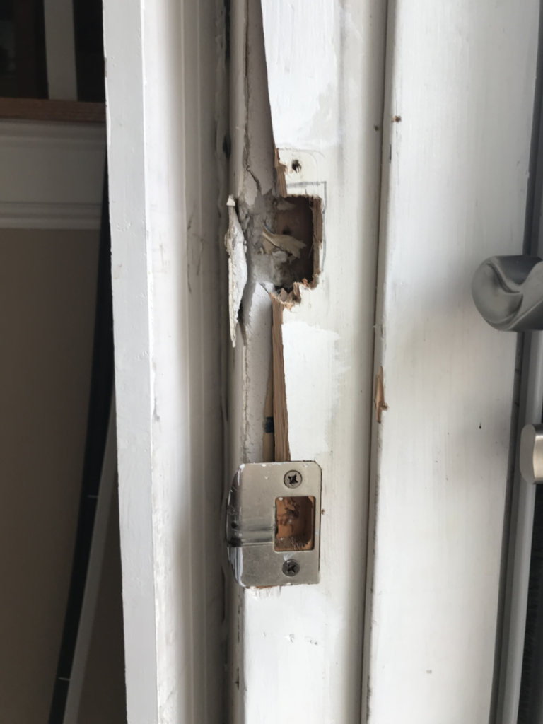 splintered section of a front door jamb