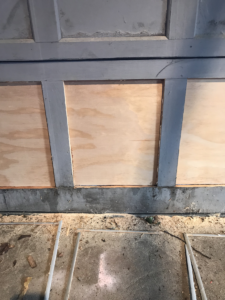 garage door bottom panels replaced with new plywood