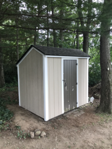 new white PVC trim installed on old shed