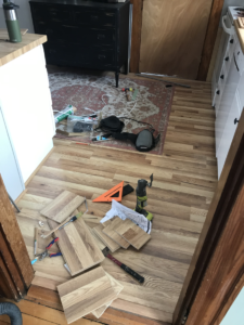 extra pieces of laminate flooring and tools